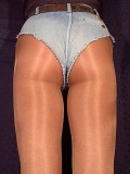 man in very shiny pantyhose and shorts