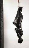Bound and hung upside down in a latex zentai dress