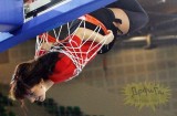 cheerleader in fishnet pantyhose bound by a basket