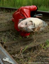  asphyxiation-bondage-42-plastic_bag_latex_catsuit_railway.jpg